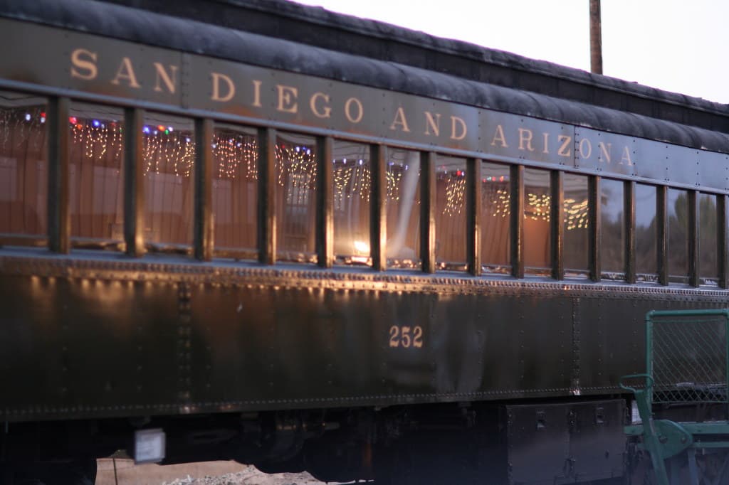 Illustrative stock photo: San Diego and Arizona coach 252 with Christmas lights glowing inside its windows