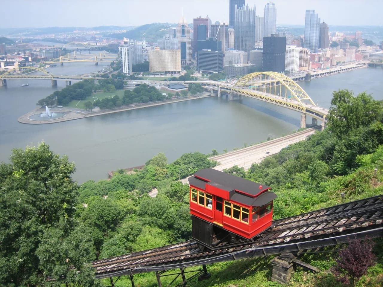 Duquesne Incline red cable car descending Mount Washington above Pittsburgh