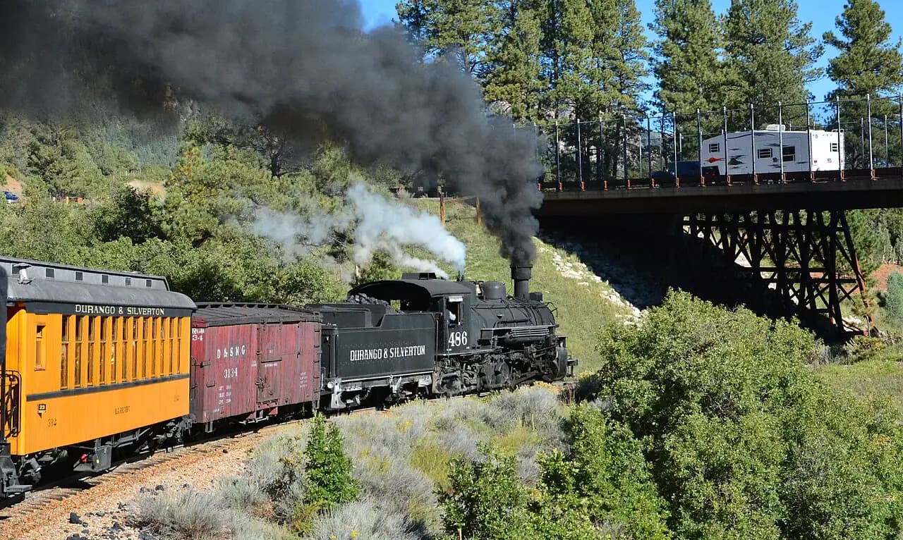 Durango and Silverton narrow-gauge steam train climbing beside a trestle