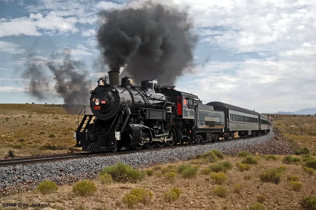 Grand Canyon Railway steam locomotive number 29 hauling a passenger train across the plateau