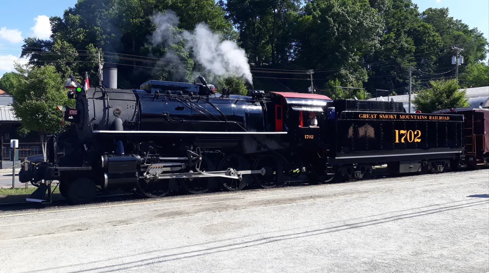 Great Smoky Mountains Railroad steam locomotive 1702 beside the Bryson City depot