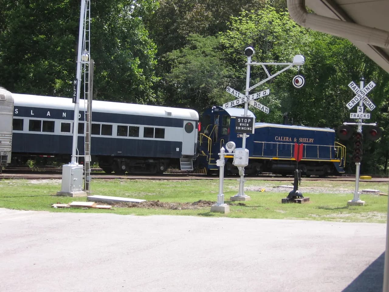 Heart of Dixie Railroad Museum excursion train passing railroad signals at Calera
