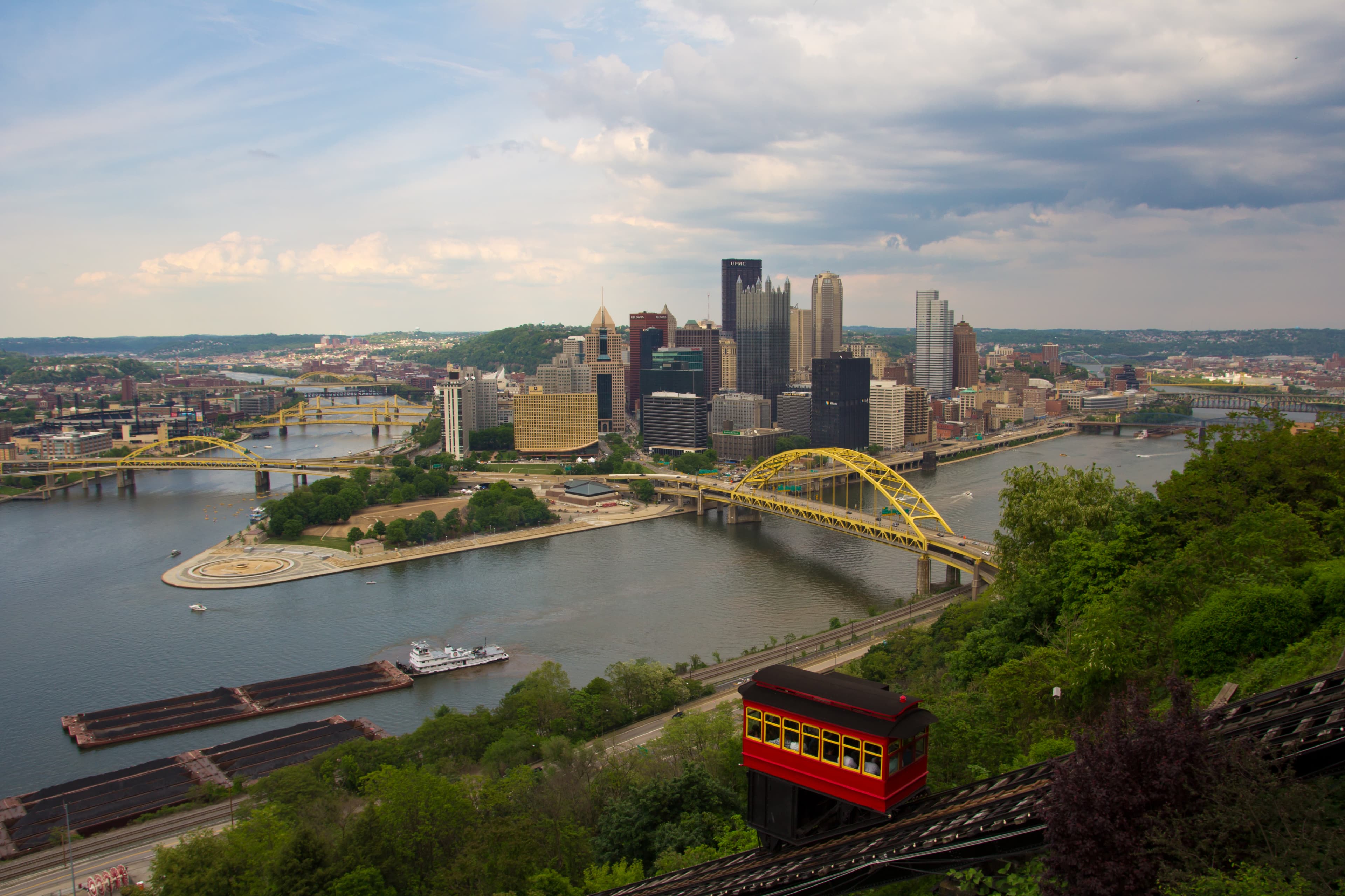 Two red Duquesne Incline cars passing on the steep track